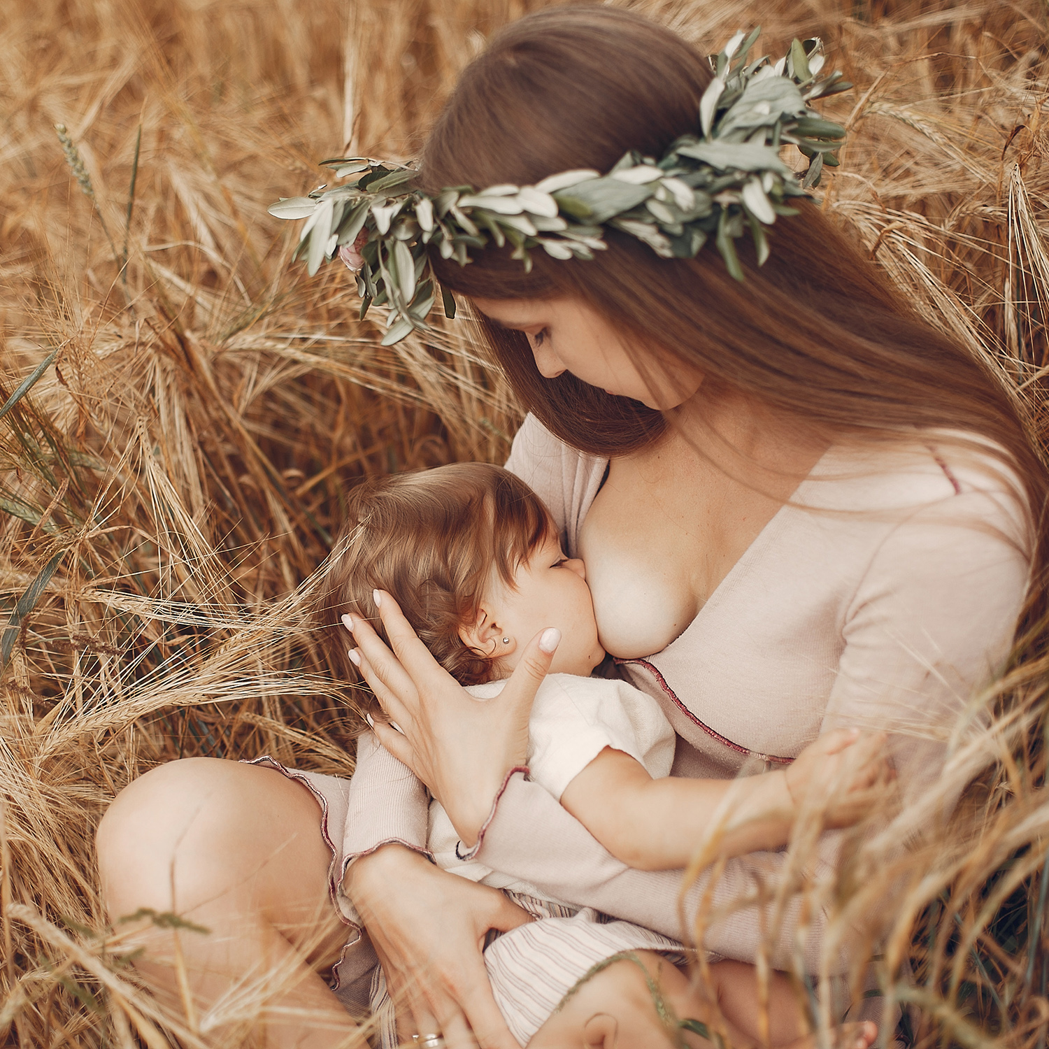 Mother with cute daughter. Mom breastfeeding her little daughter
