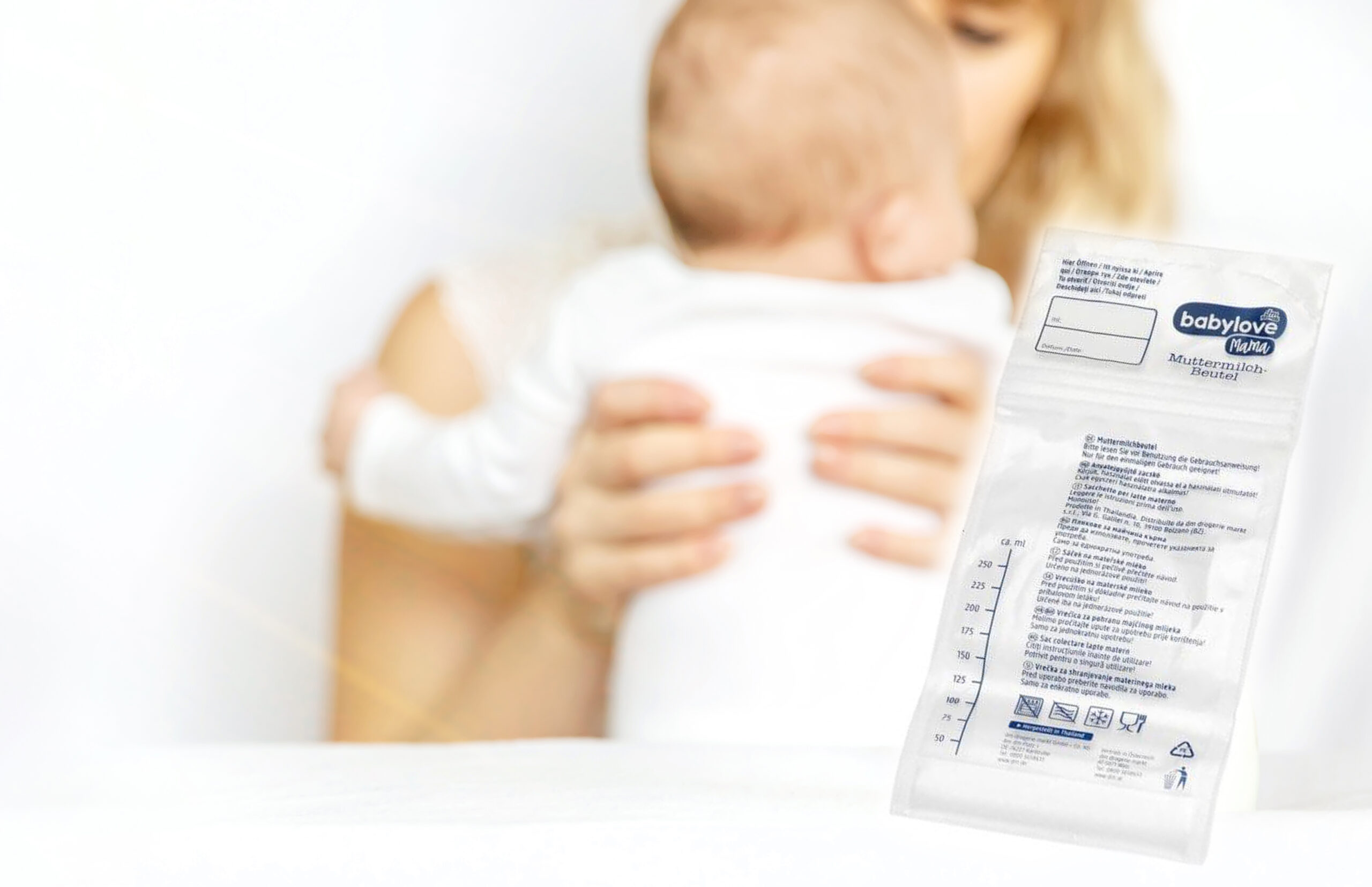 Mother feeds the baby from a bottle. Selective focus. People.